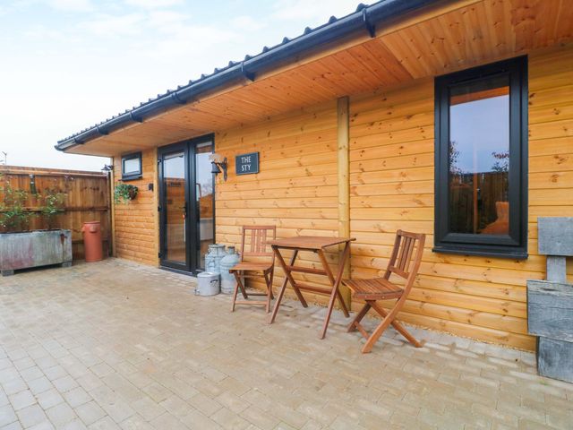 An outdoor area with a table and chairs at The Sty in Derby
