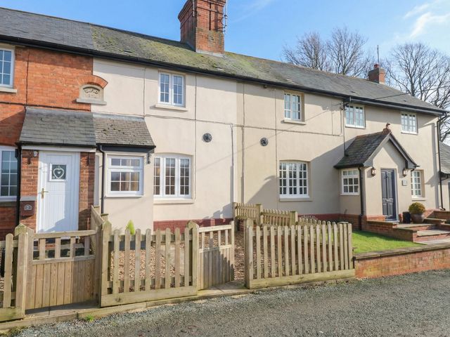 A house with a fence and garden at Little Launde Cottage in Launde near Braunston-In-Rutland