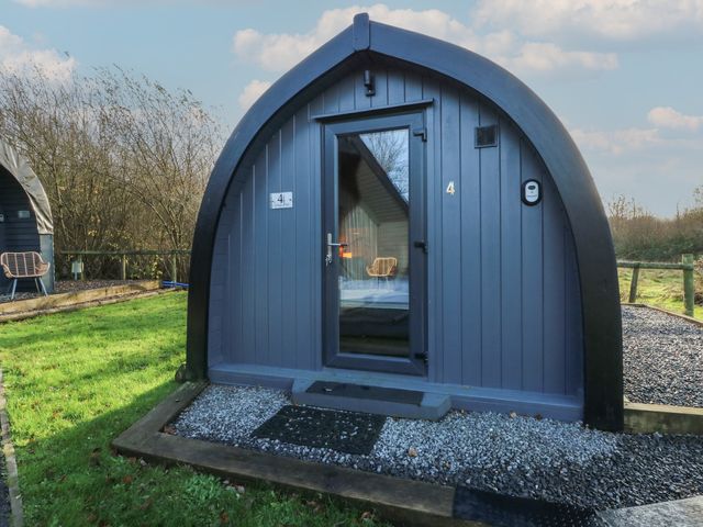 A cabin with a door and window in front at Garden Lodge 4 Swansea