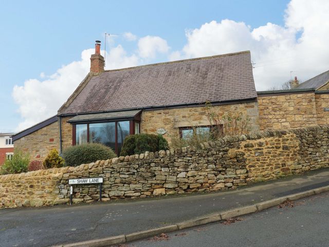A house with stone wall and garden on Shaw Lane in Consett