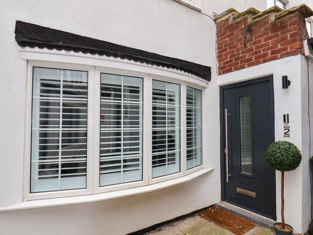 A home entrance with a front door and window at Og's House in Whitby