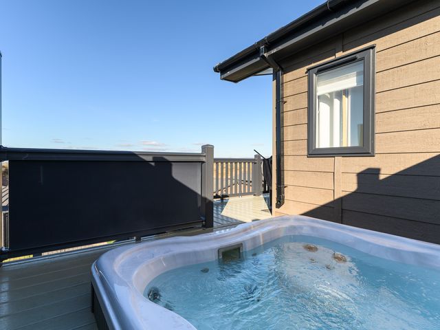 A hot tub on a deck at Keswick (Pet) Penrith