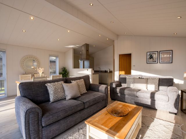 A living room with sofas and a coffee table at Belfry in Waltham