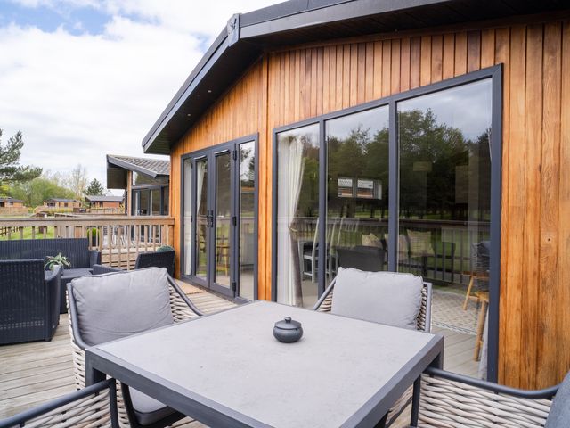 An outdoor seating area with a table and chairs at The View in Waltham
