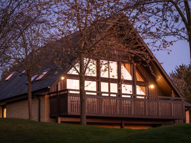 A house with a balcony and trees at The Hexham in Slaley
