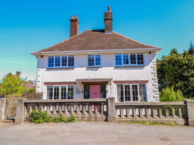 A house with windows and a pink door at The White House in Bracondale
