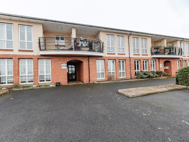A building with balconies and windows at 5 Mariners Wharf Newhaven