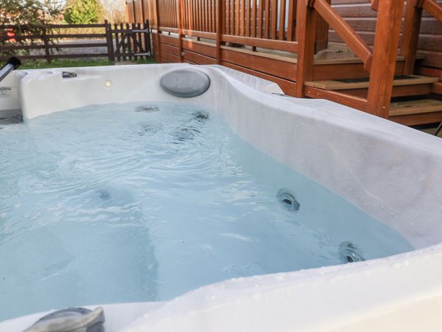 A hot tub with water visible at Lakeside Lodge in Stonham Aspal