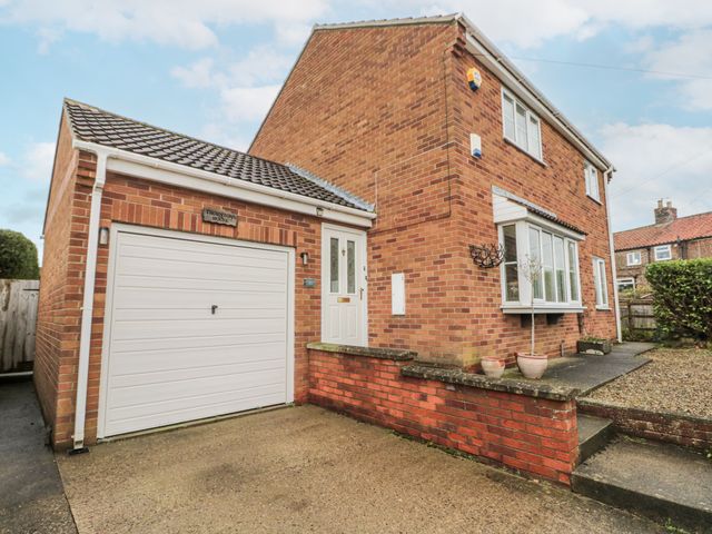 A house with a garage and front door at Thorntons House in Northallerton