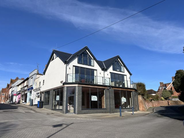 A modern building with glass facade on a street at 2A Hamilton Road, Felixstowe, Suffolk