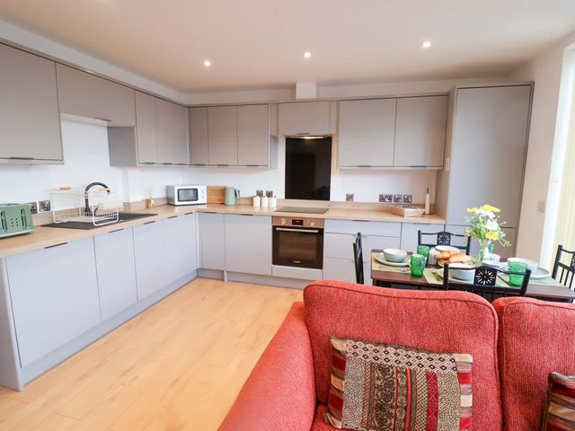 A kitchen with cabinets and appliances at 2B Hamilton Road in Felixstowe, Suffolk