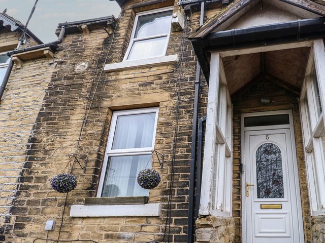 Exterior view of a house with a door and windows at Chestnut Lodge in Bradford