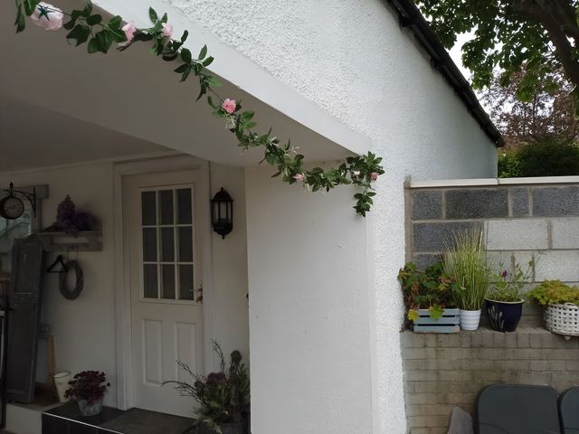 An outdoor area with a door and flower decoration at 14 Largo Road in Leven