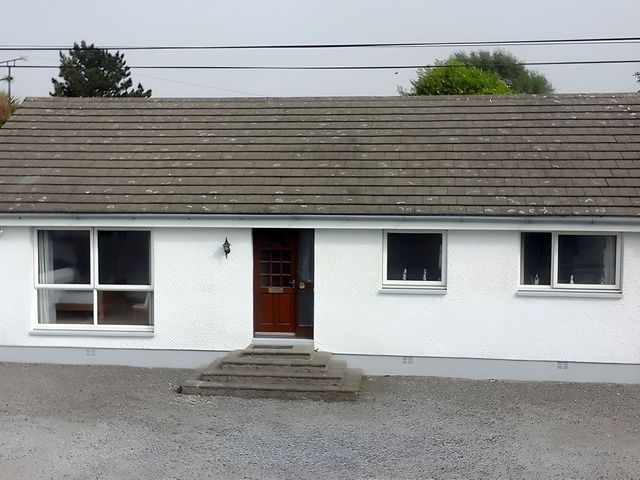 A house with a front door and windows at Culnacraig in Stranraer