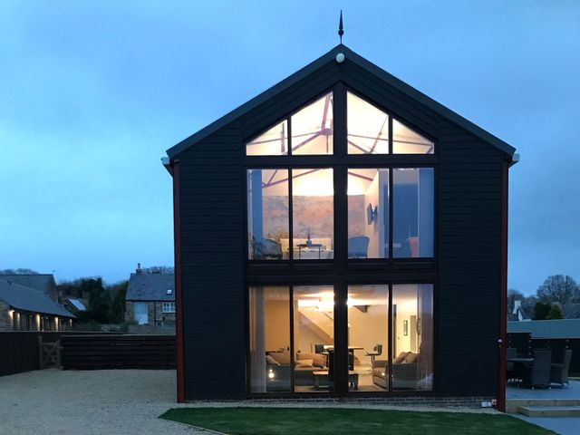 A house with large windows and a garden at High Church Hill in Durham