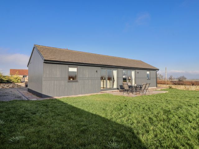 A house with a patio and seating area at Fleetwood in Richmond