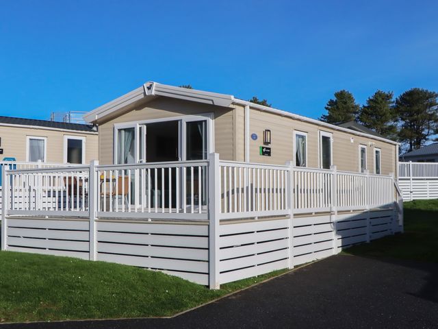 A mobile home with a deck at Caravan C31 at Landscove Holiday Park Brixham