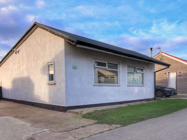 A house with windows and a car parked at Sea View Retreat in Bridlington