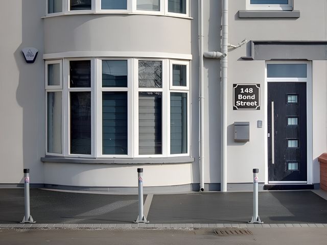 The front of a building with windows and a door at Apartment 1 Blackpool