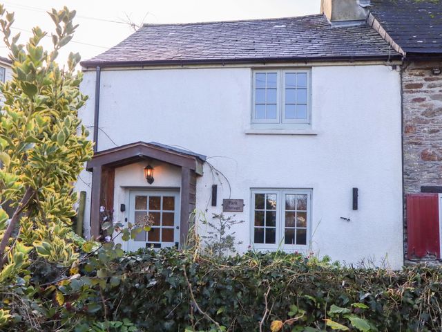 A house exterior with door and windows at Park Cottage in Kingsbridge