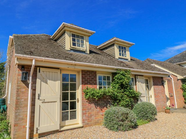A house with windows and a door at New Barn in Broad Chalke