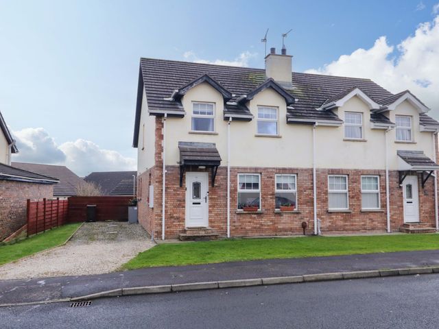 A house with a garden and pathway at Primrose Seaside Escape