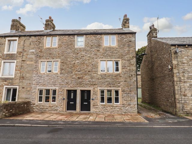 A building facade with windows and doors at 1 Grosvenor Farm Cottages Skipton