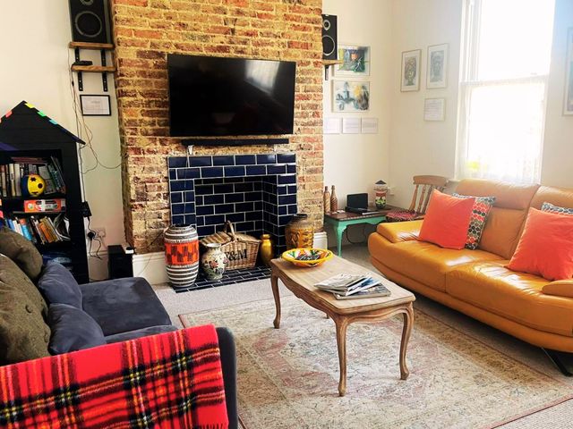A living room with a sofa and a coffee table at 21 Gensing Road St. Leonards-on-Sea