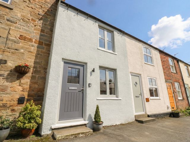 A view of the front of a house with doors and windows at Brooklyn Cottage Kirkby Malzeard