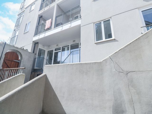 An outdoor area with stairs and a balcony at 11 Fountain Court in Falmouth