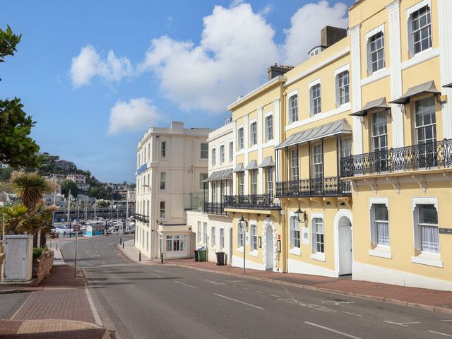 A street view of buildings and road at Flat 2 The Moorings in Torquay