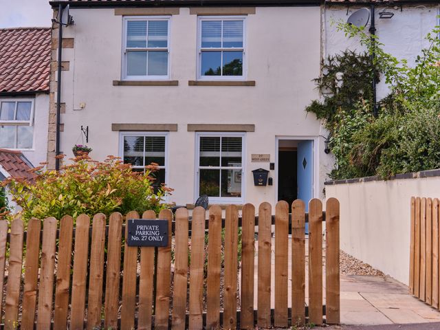 A house with a front yard and parking sign at 27 West Green in Heighington