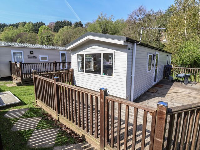 A cabin with a deck and railings at N5 Ilfracombe
