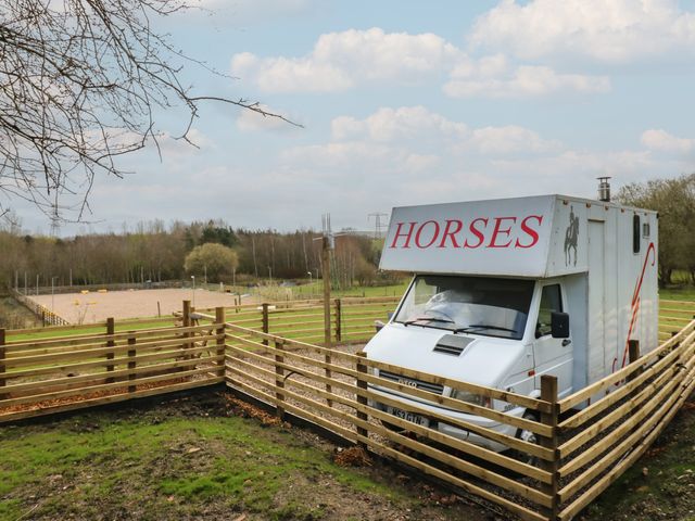 A horsebox and fenced area with a field at The Horse Box in Blaydon-on-Tyne