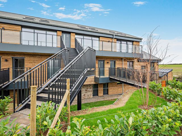 A building with stairs and balconies at Walesborough Penthouse 2.0, Marhamchurch