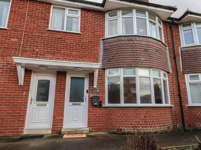 A front view of a brick house with front door and windows at Flat 6 Lytham St. Annes