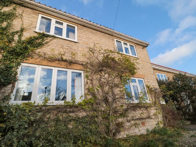 An exterior view of a house with windows and ivy at St. Anthonys in York