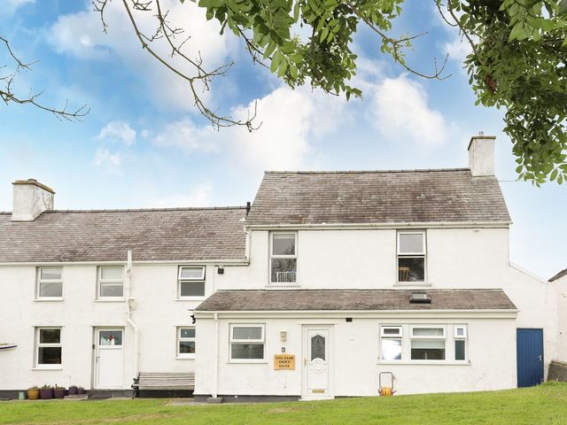 A house with a door and windows at Bodlasan Groes House in Holyhead