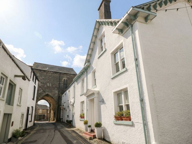 A street with buildings and an archway at Flat 4 Tower House Grange-Over-Sands