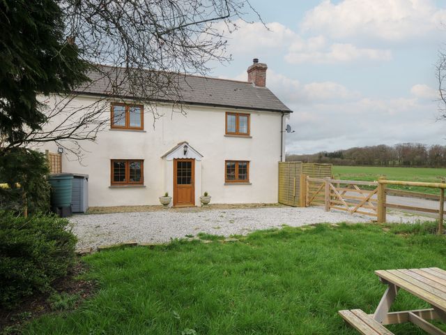 A house with a front door and windows at Little Blagdon in Ashwater