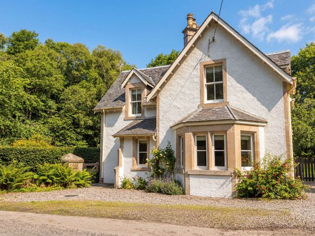 A house with windows and garden at Station Lodge near Forres