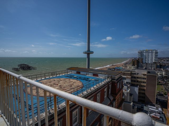 An outdoor view of the ocean and pier from a building at Beachfront Penthouse Brighton