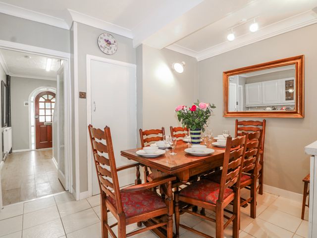 A dining room with a table and chairs at The Retreat in Deal