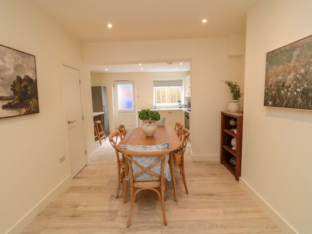 A dining room with a table and chairs at No.9 Trafalgar St West in Scarborough