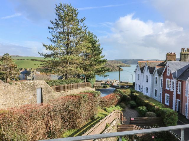 A view of cottages and water from a hillside at 4 The Elms Salcombe