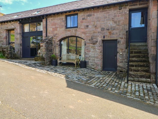 An outdoor area with steps and a bench at Pearls Farm One Wildboarclough near Macclesfield