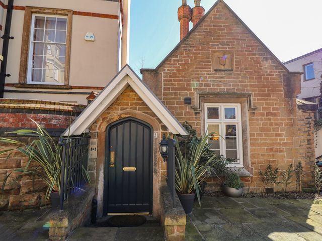 A front entrance with a door and plants at Tower Cottage in Nottingham