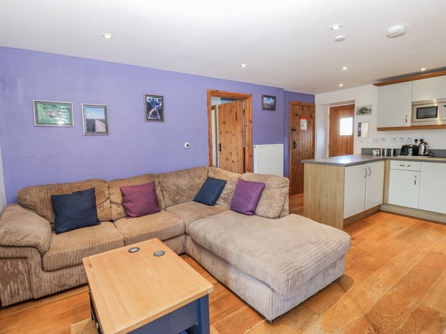 A living room with a sofa and coffee table at Swallows Rest in Hexham