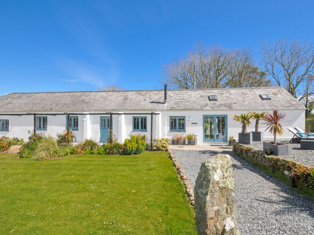 A house with a garden and pathway at The Cowshed in Portscatho