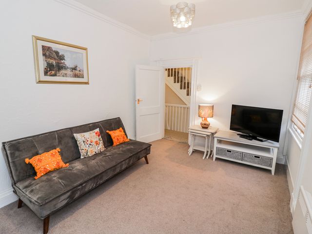 A living room with a couch and TV at Little Marrakesh Lodge in Worcester